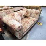 A Victorian two seater settee with scatter cushions