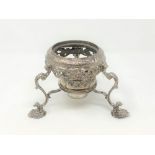 An early 18th century ornate silver kettle stand with burner, height 13cm.
