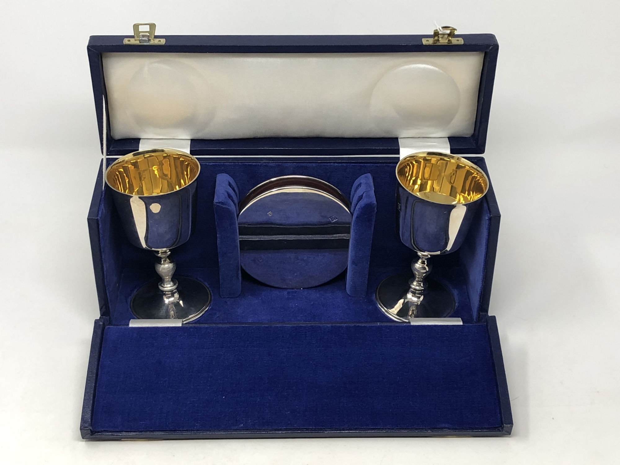 A good quality silver-gilt communion set, boxed.
