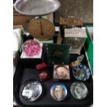 A tray of paperweights, decorative mantle clock,
