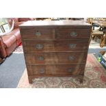 A George III mahogany five drawer chest with metal drop handles