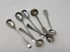 Seven assorted antique silver salt spoons (7)