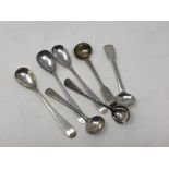 Seven assorted antique silver salt spoons (7)