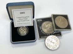 A silver proof one pound coin, boxed with certificate,