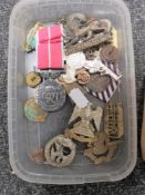 A small quantity of military and other badges and buttons,