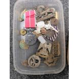 A small quantity of military and other badges and buttons,