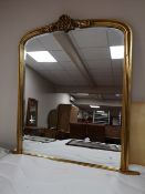 A Victorian style bevelled overmantel mirror CONDITION REPORT: 126cm wide by 132cm