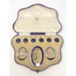 A fine quality cased silver gilt and purple enamel buckle, pair of shoe buckles, and six buttons,