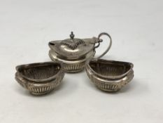 A three piece silver condiment set,