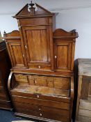 A nineteenth century roll topped bureau bookcase