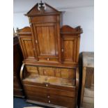 A nineteenth century roll topped bureau bookcase