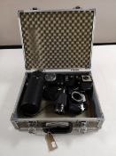 An olympus OM10 camera, two lenses,
