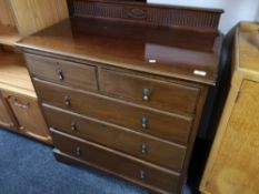 An Edwardian mahogany five drawer chest