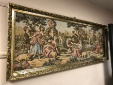 A gilt framed tapestry - lovers in a landscape