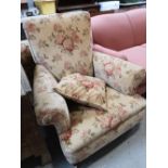 A Victorian armchair in floral fabric