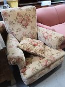 A Victorian armchair in floral fabric