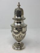 A large ornate silver sugar castor decorated with floral swags, 265g, height 22.5cm.