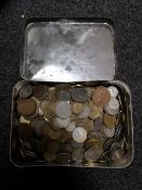 A tin of coins,