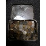 A tin of coins,