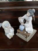 A Lladro figure - Geisha together with a small Lladro figure of a child holding a polar bear