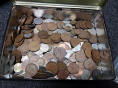 A tin of coins,