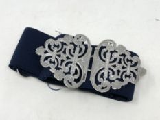 A Victorian silver buckle on elasticated belt,