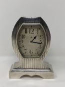 A good quality Art Deco silver cased 8 day mantel clock,