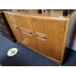 An early twentieth century oak sideboard