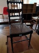 A 19th century bedroom chair with bergere seat.