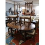 An Ercol extending table and four chairs