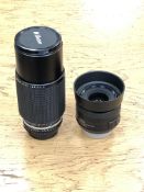 A Nikon lens series E, zoom 70-210mm 1:4, numbered 1876914,