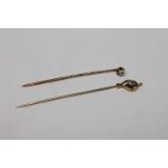 Two antique gold diamond set stick pins, about 0.