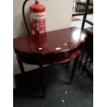 A reproduction mahogany side table fitted a drawer