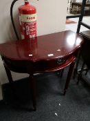 A reproduction mahogany side table fitted a drawer