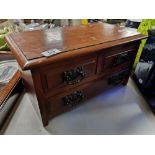 An Edwardian three drawer miniature chest