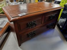 An Edwardian three drawer miniature chest