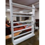 A painted white plate rack