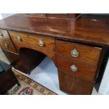 An early nineteenth century mahogany pedestal sideboard