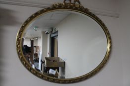 An ornate bevelled gilt framed mirror