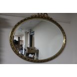 An ornate bevelled gilt framed mirror