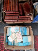 A box of penguin blue books and further set of books