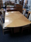 A high gloss reproduction dining table and four chairs