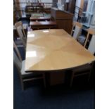 A high gloss reproduction dining table and four chairs