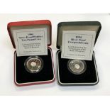 Two silver proof two-pound coins,