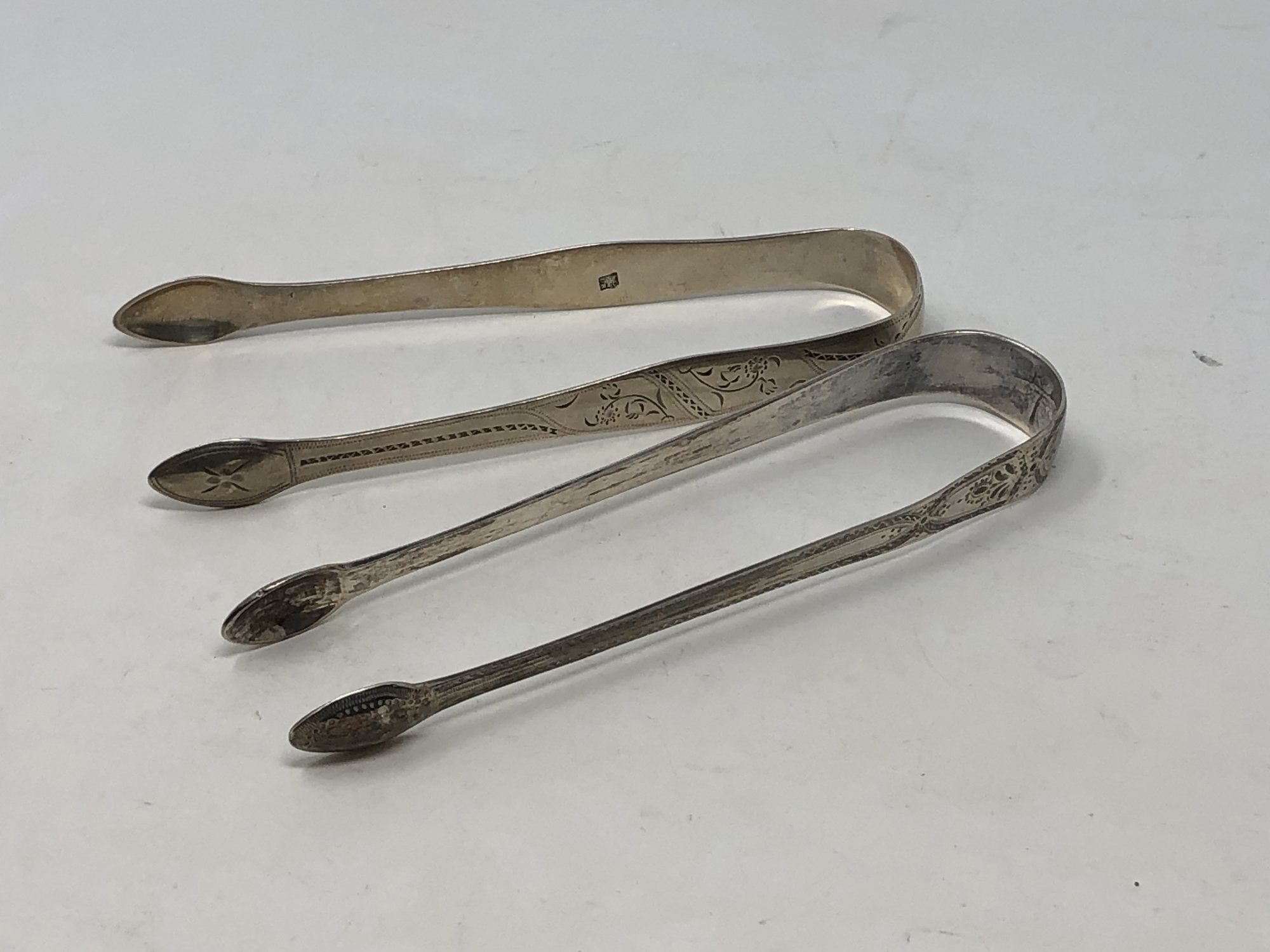 Two pairs of Georgian silver sugar tongs (2) CONDITION REPORT: 70.6g gross.