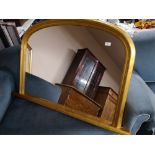 A gilt framed overmantel mirror