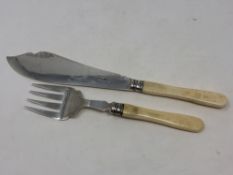 A pair of silver and ivory fish servers,