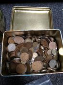 A tin of coins,