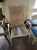 A metal and plastic mid century white chair.