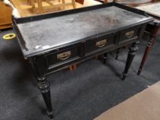 A nineteenth century painted three drawer side table